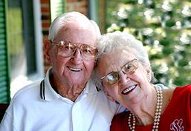Photo of a couple smiling.