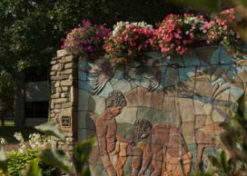 Photo of a stone mural, The River of Faith. Photo of a stone mural.